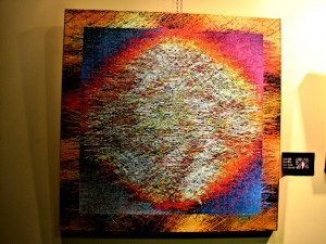 thousands of threads glued onto carpet canvas