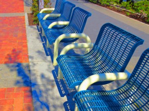 blue benches on board walk